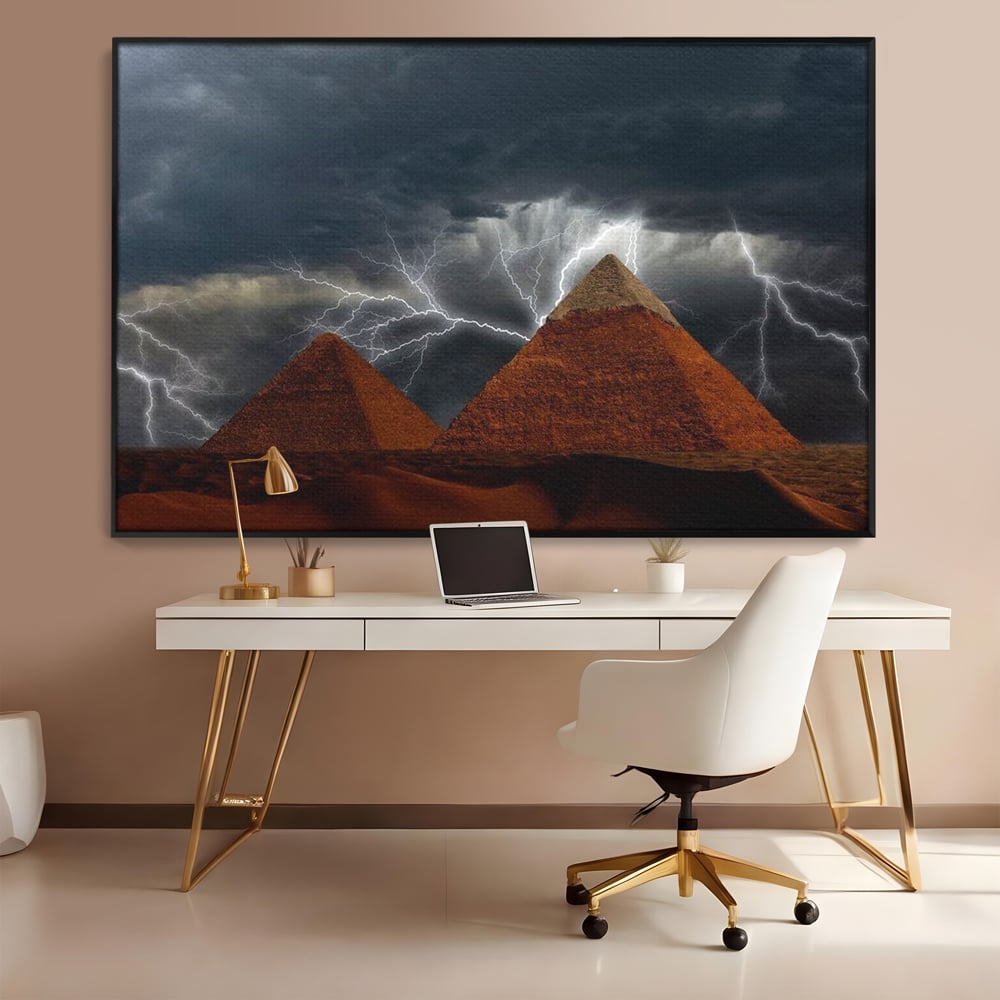 Tablou canvas cu ilustratie cu piramide si fulgere, in rama de aluminiu negru, pe perete intr-un birou